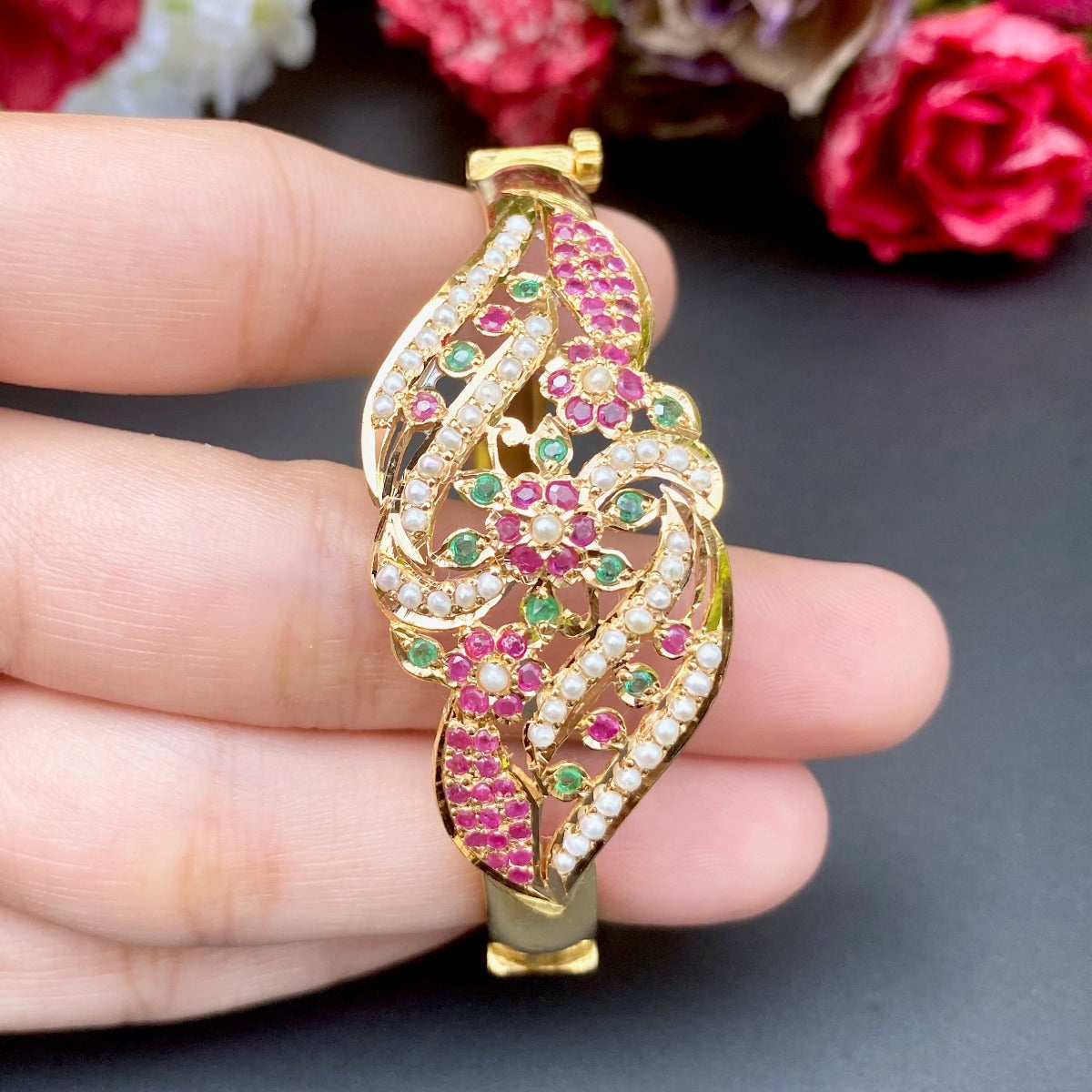 gold bracelet with rubies and emeralds