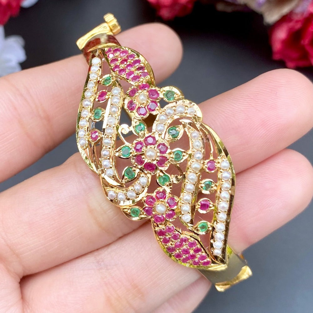 gold bracelet with rubies and emeralds