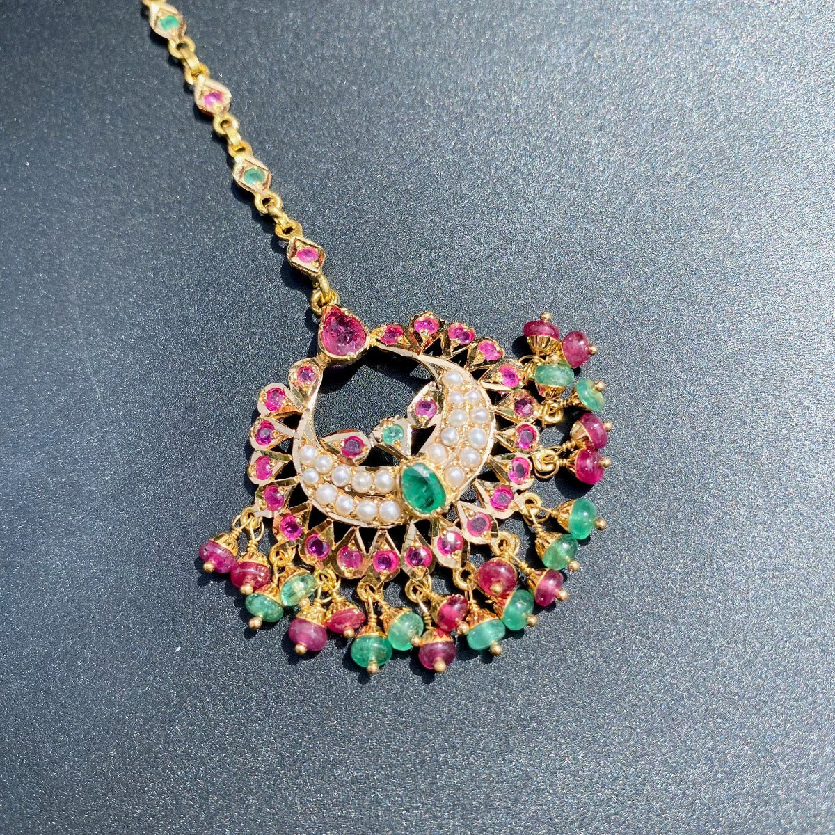ruby emerald jadau teeka gold
