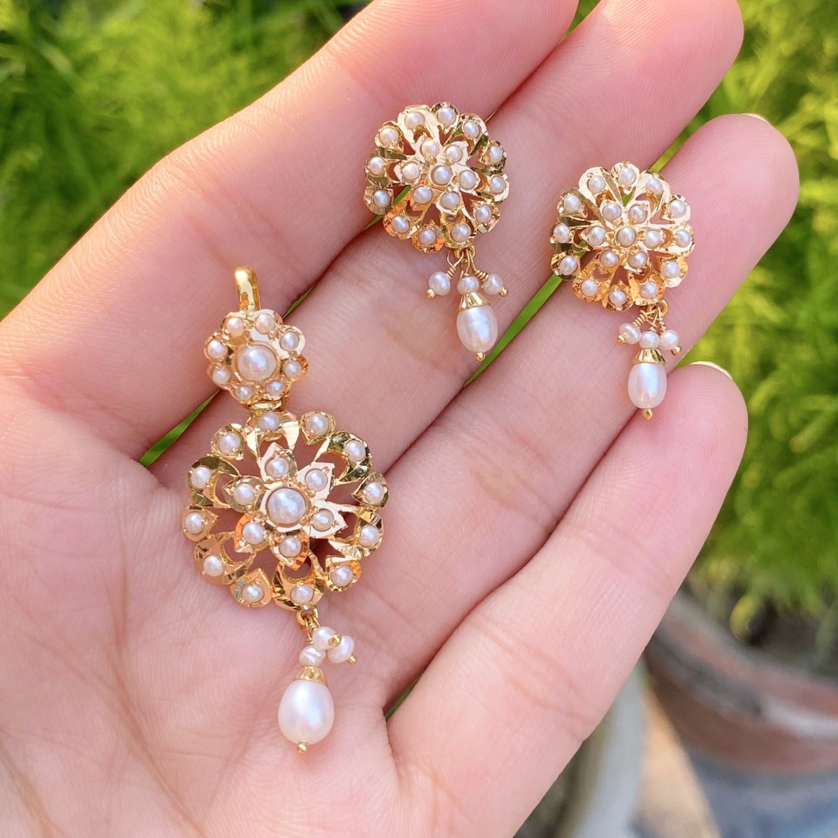 dainty gold pendant set with pearls