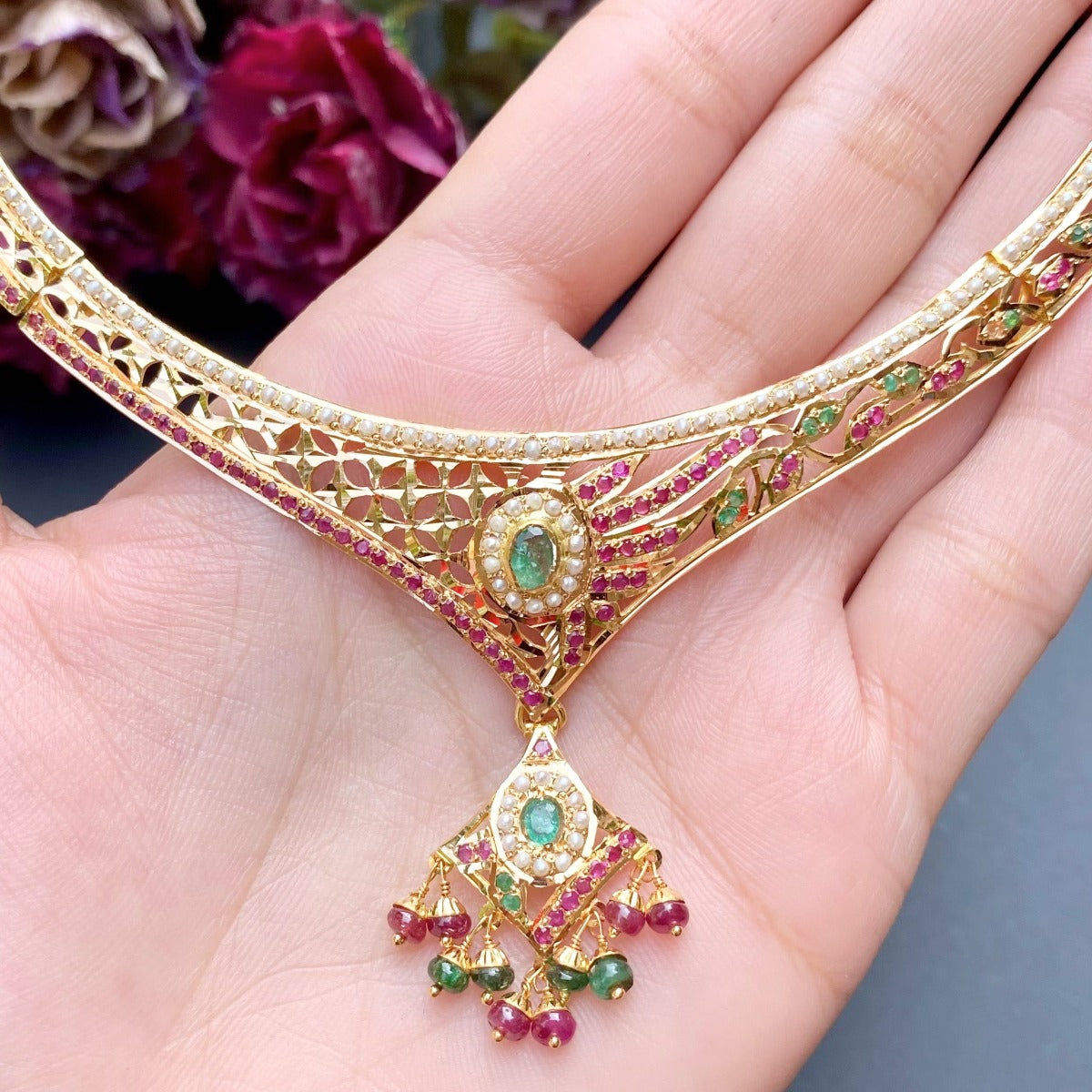 delicate jadau set with ruby emerald and pearls