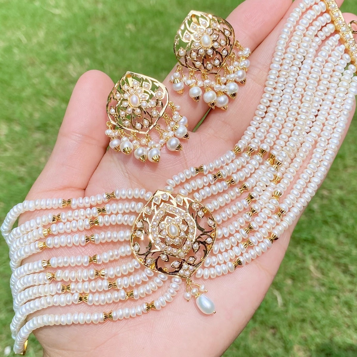 modern pearl choker on gold