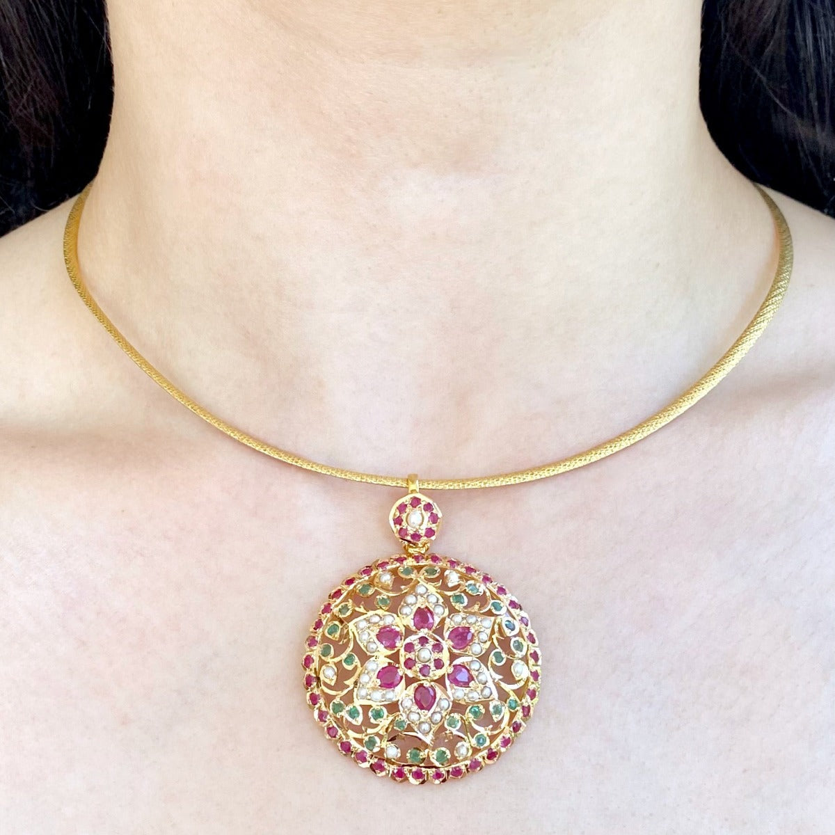 round gold pendant