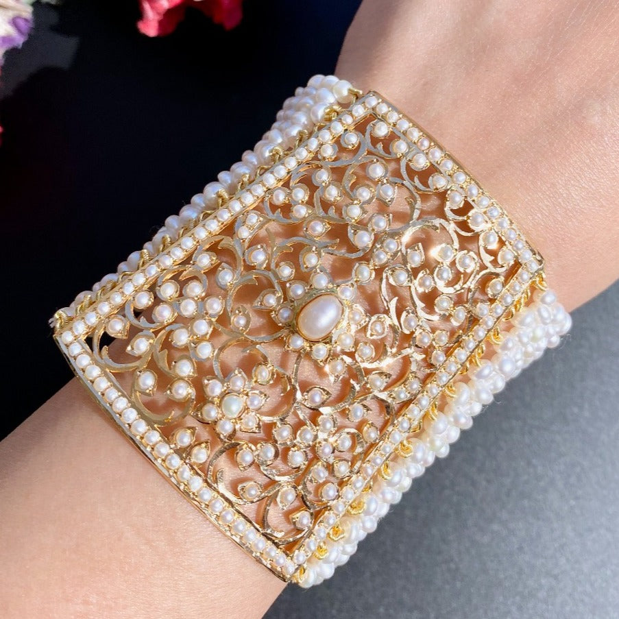 punjabi bahi in 22k gold studded with freshwater pearls. also called mughalai kalai or glass or rajasthani bajubandh