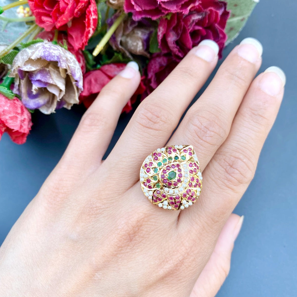 gold ring with studded stones