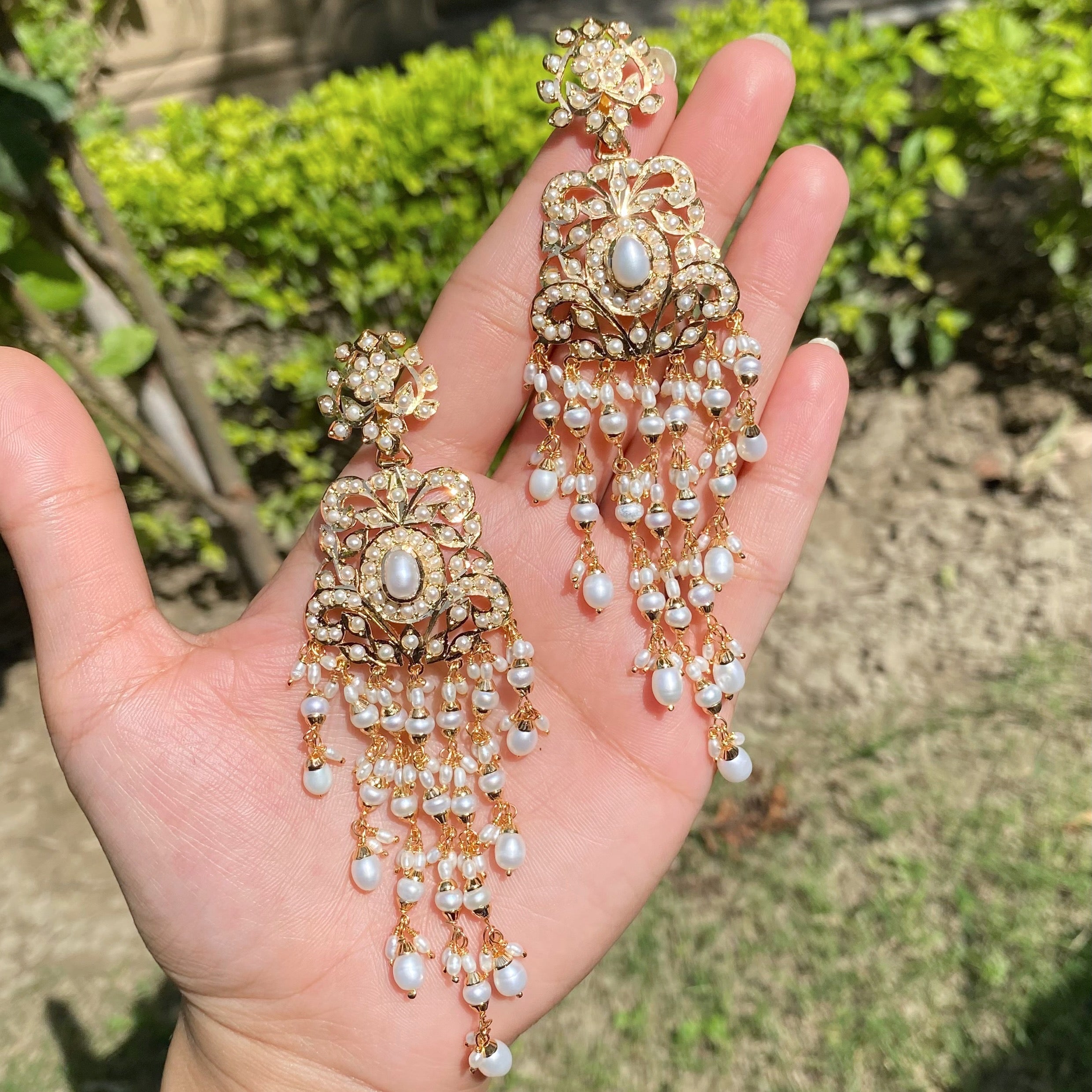 long gold plated indian earrings studded with pearls