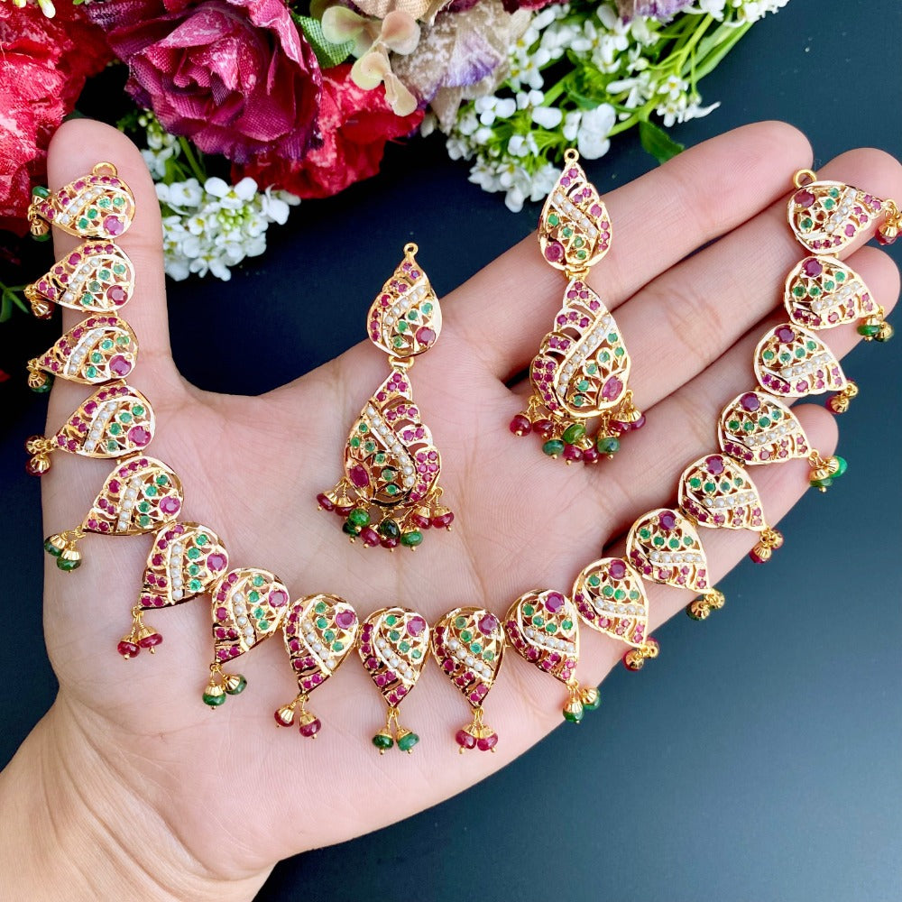 simple dainty indian jewelry set made on 22k gold and studded with ruby emerald pearls