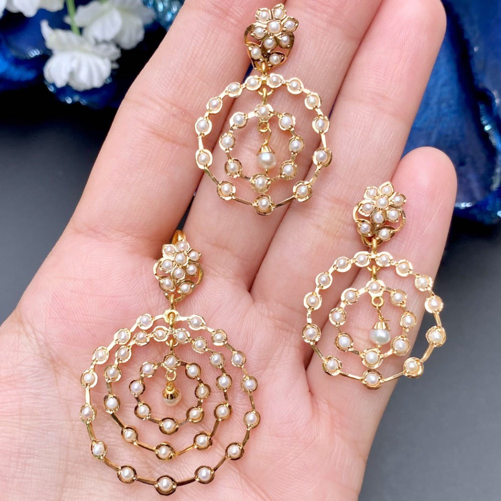 gold pendant set studded with pearls for women