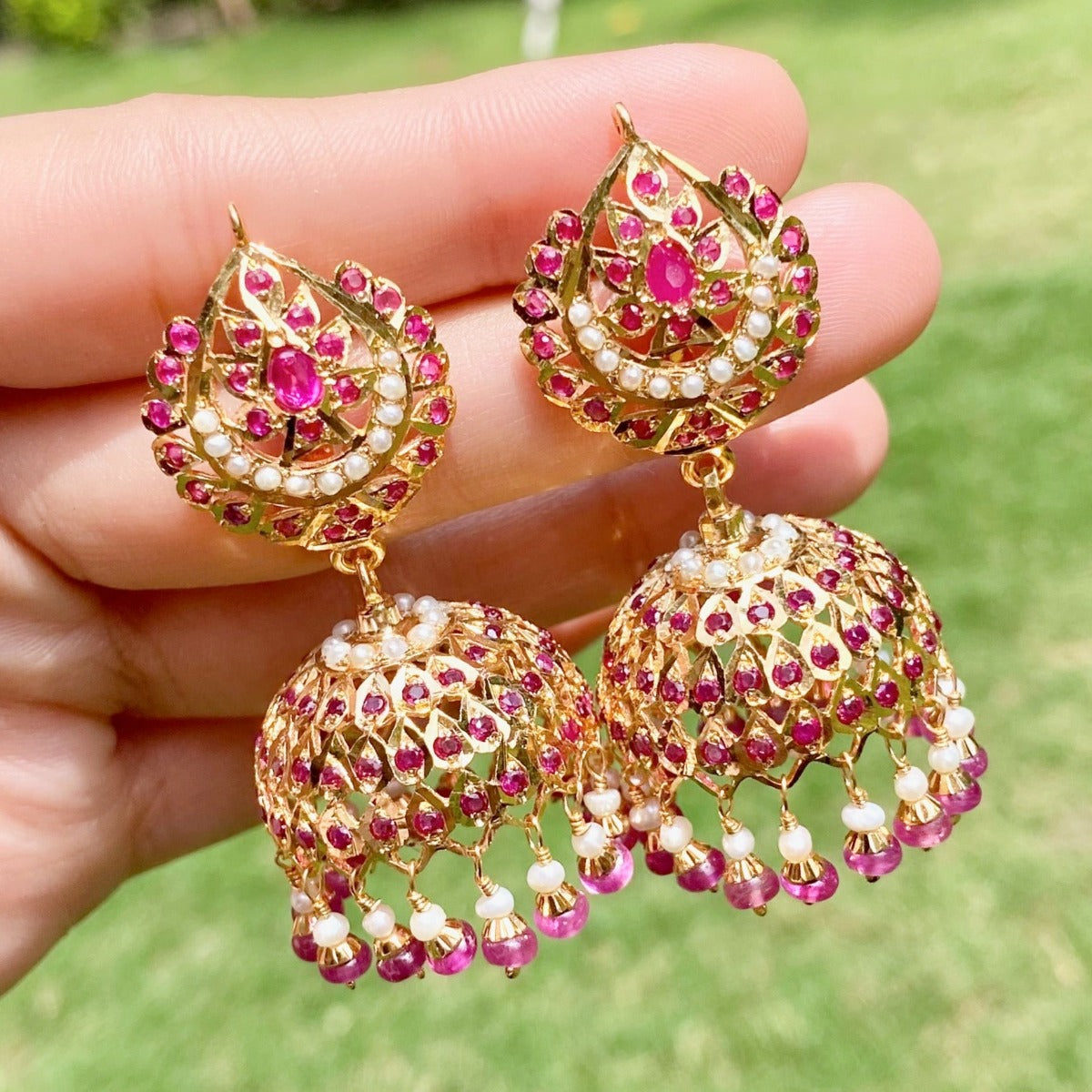 gold plated rajasthani jhumka earrings studded with ruby and pearls on 925 silver