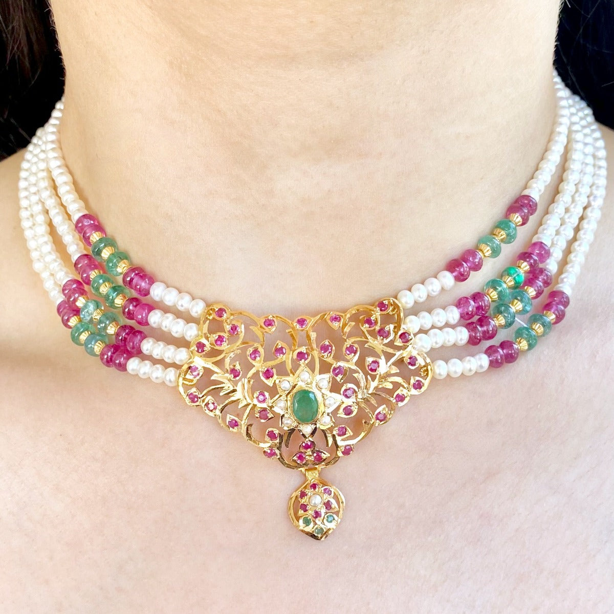 sober gold choker with ruby emerald