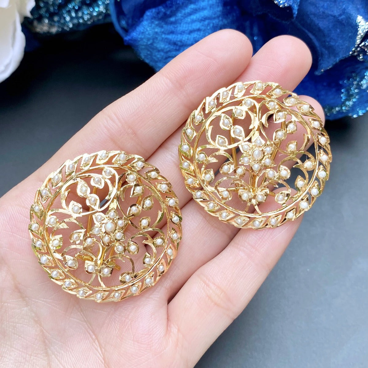 22k gold stud earrings studded with pearls