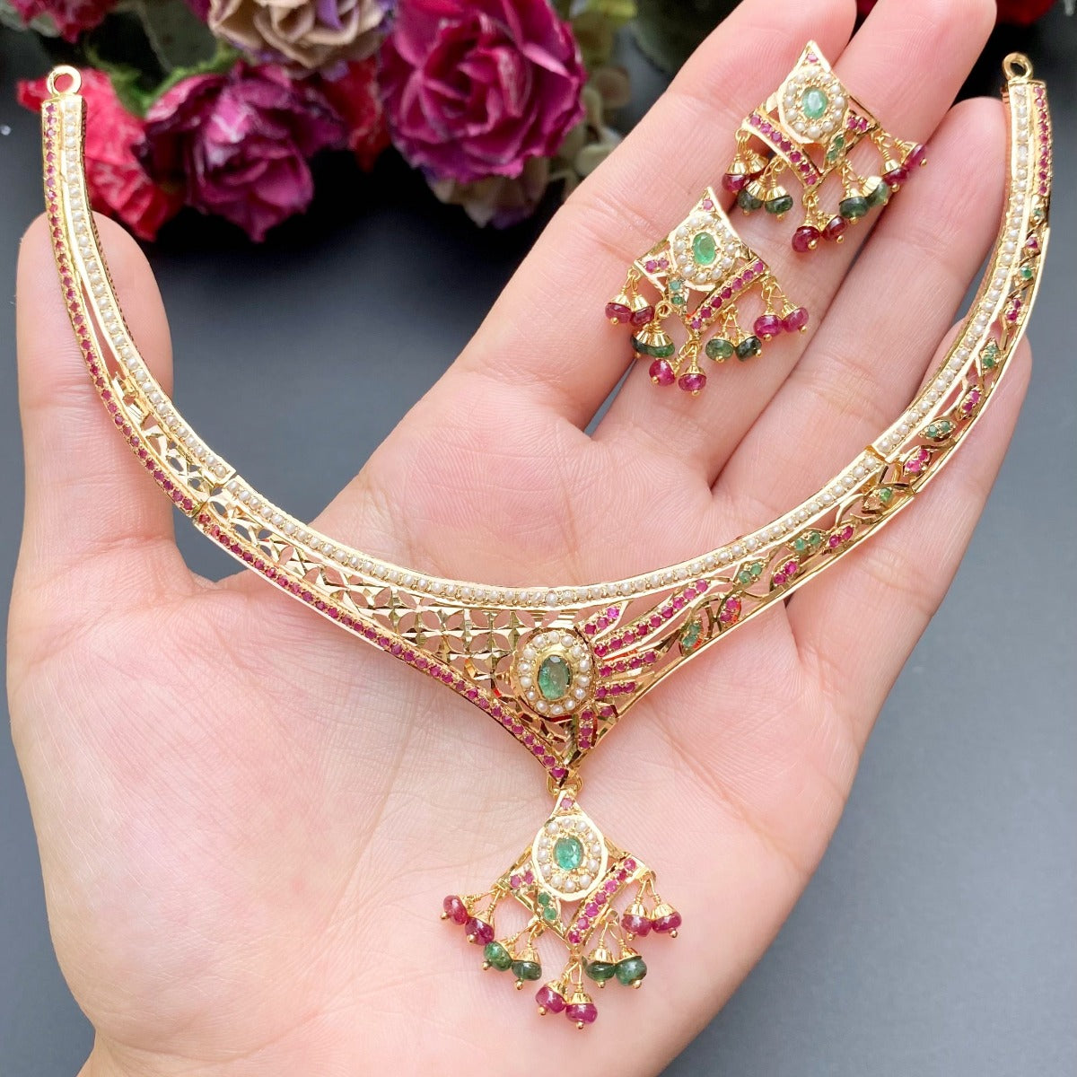 delicate jadau set with ruby emerald and pearls