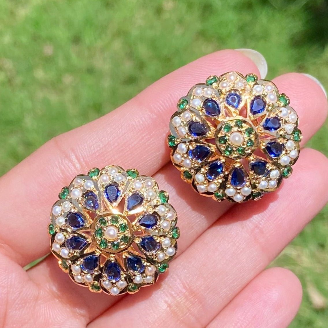 big stud earrings on sterling silver with gold plating studded with blue green stones and pearls