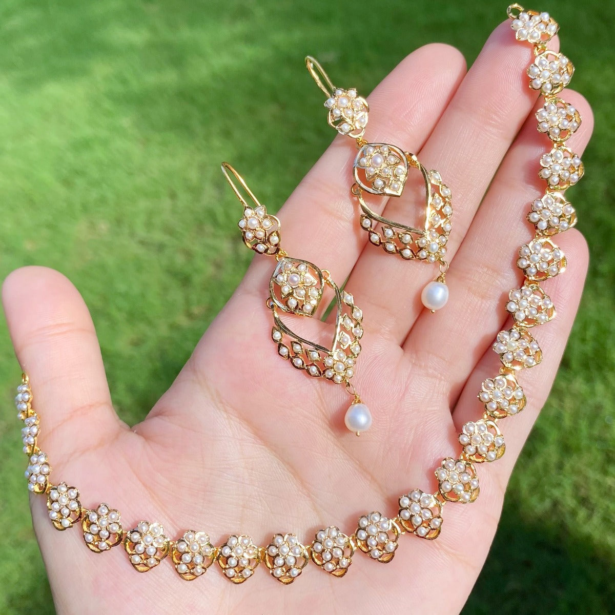 gold set under 150000 for women studded with pearls