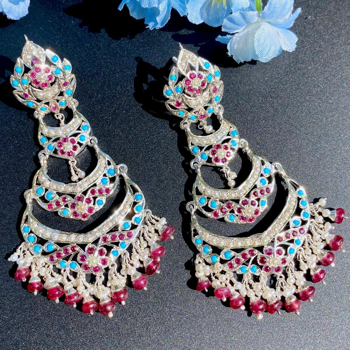 silver danglers with red and blue stones