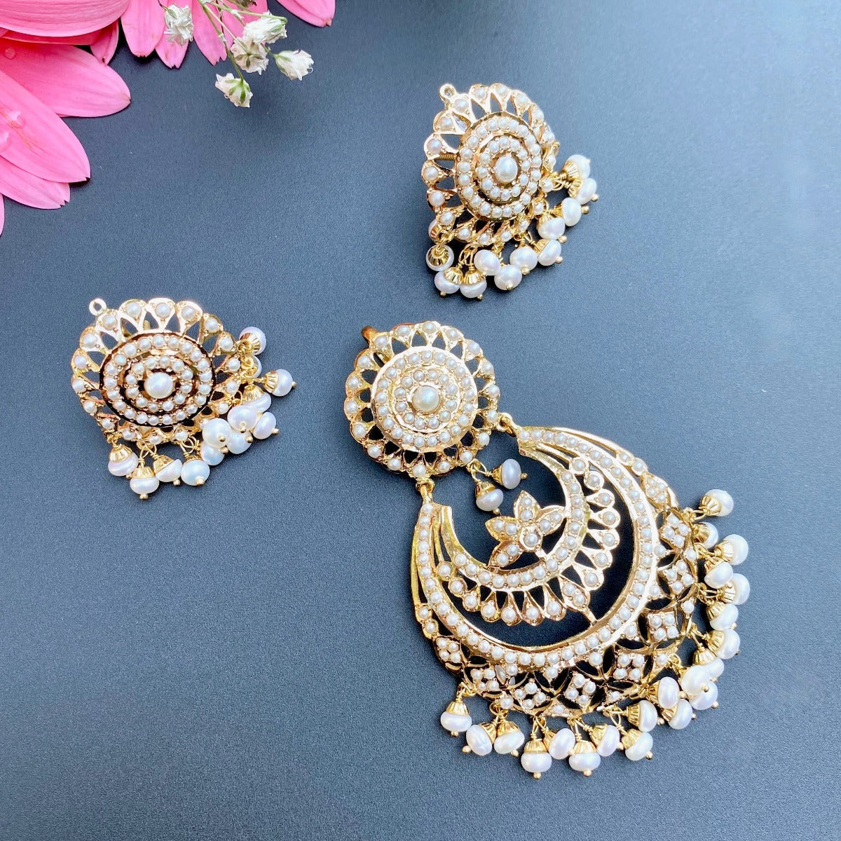 gold pendant set studded with pearls