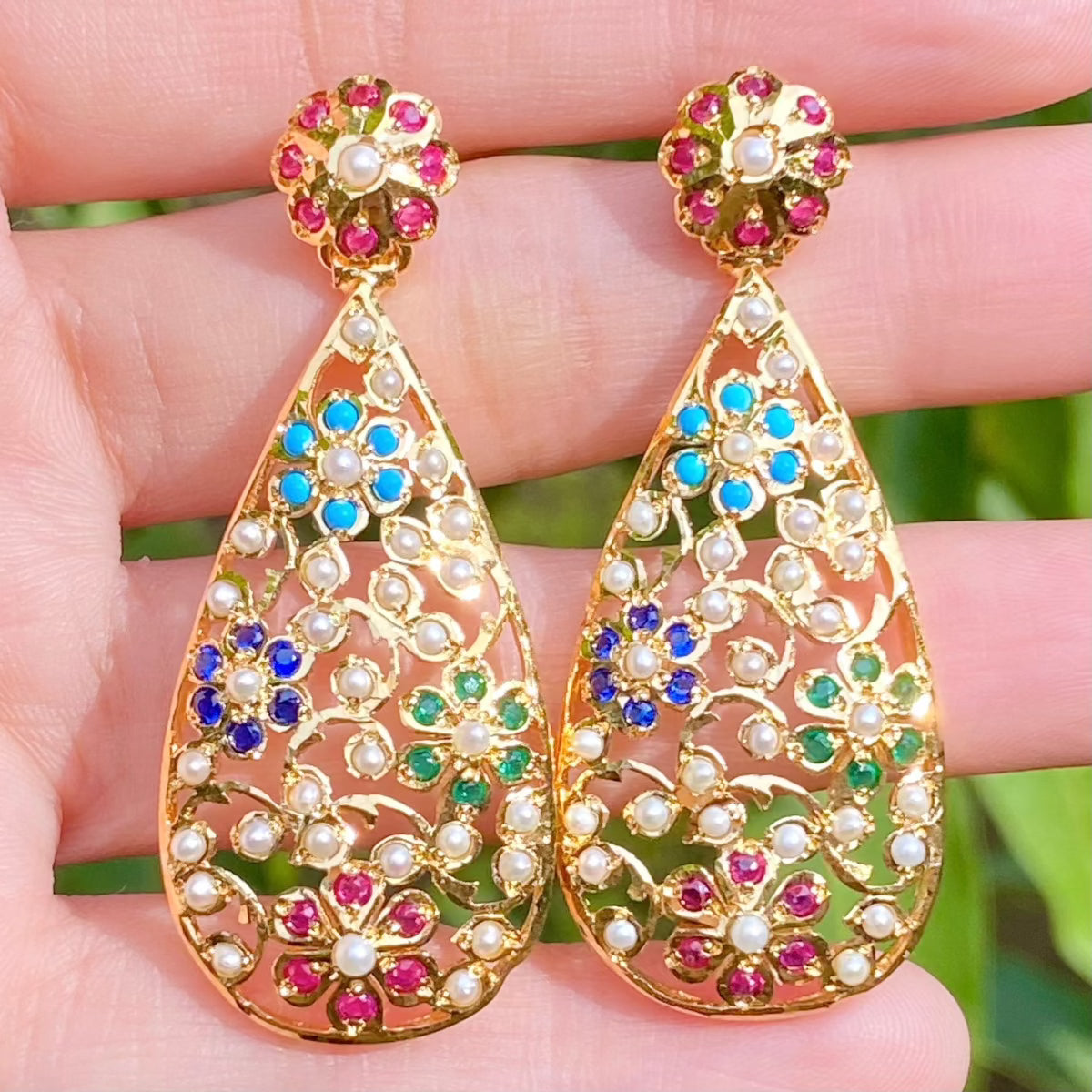 modern navratna earrings in a drop shaped floral design