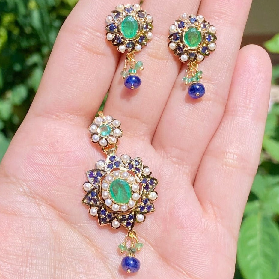 indian gold pendant set studded with emerald and sapphire