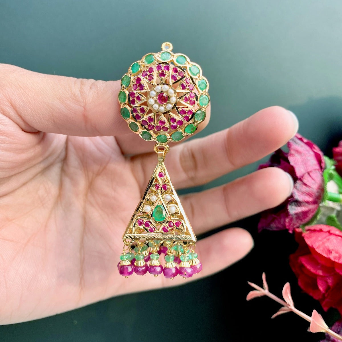 gold jhumka with ruby emerald stones